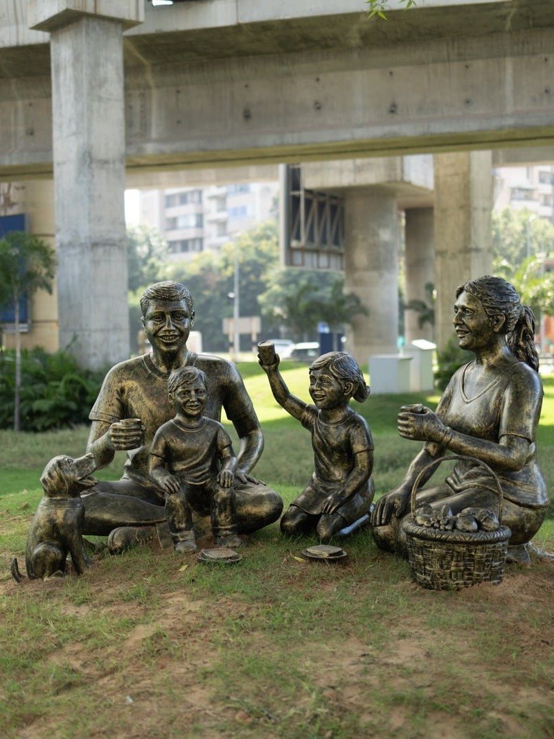 Bronze sculpture of a family picnic with their dog, MAX Estates