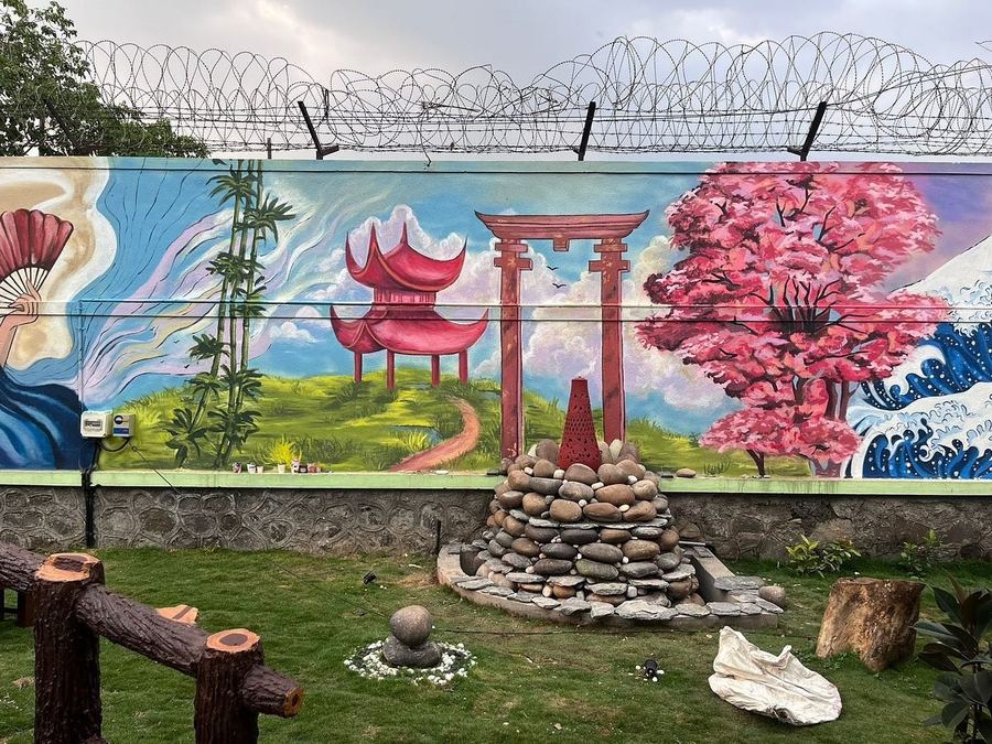 Reserve Bank of India mural with a torii gate and cherry blossoms